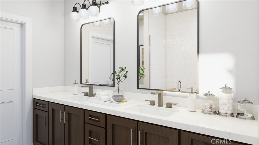 59 Bigsby Drive Stanton, CA 90680 - Photo 9 of 11 a bathroom with double vanity sinks and a mirror