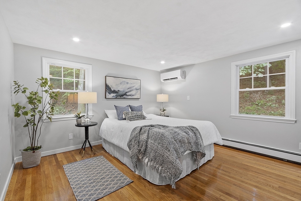 167 Harvard Road Stow, MA 01775 - Photo 15 of 27 a bedroom with a large bed and a window