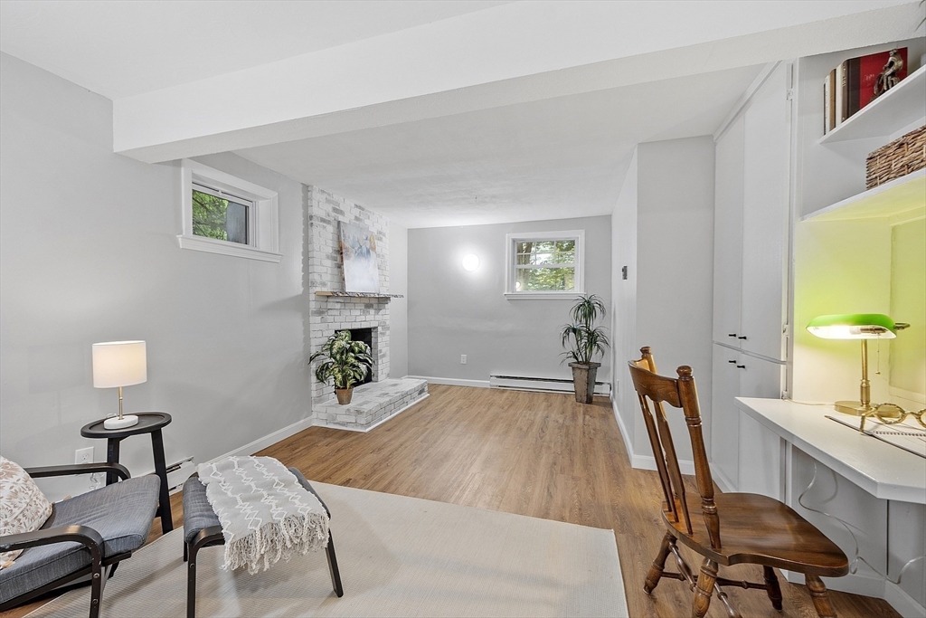 167 Harvard Road Stow, MA 01775 - Photo 24 of 27 a bedroom with a bed large window and chair
