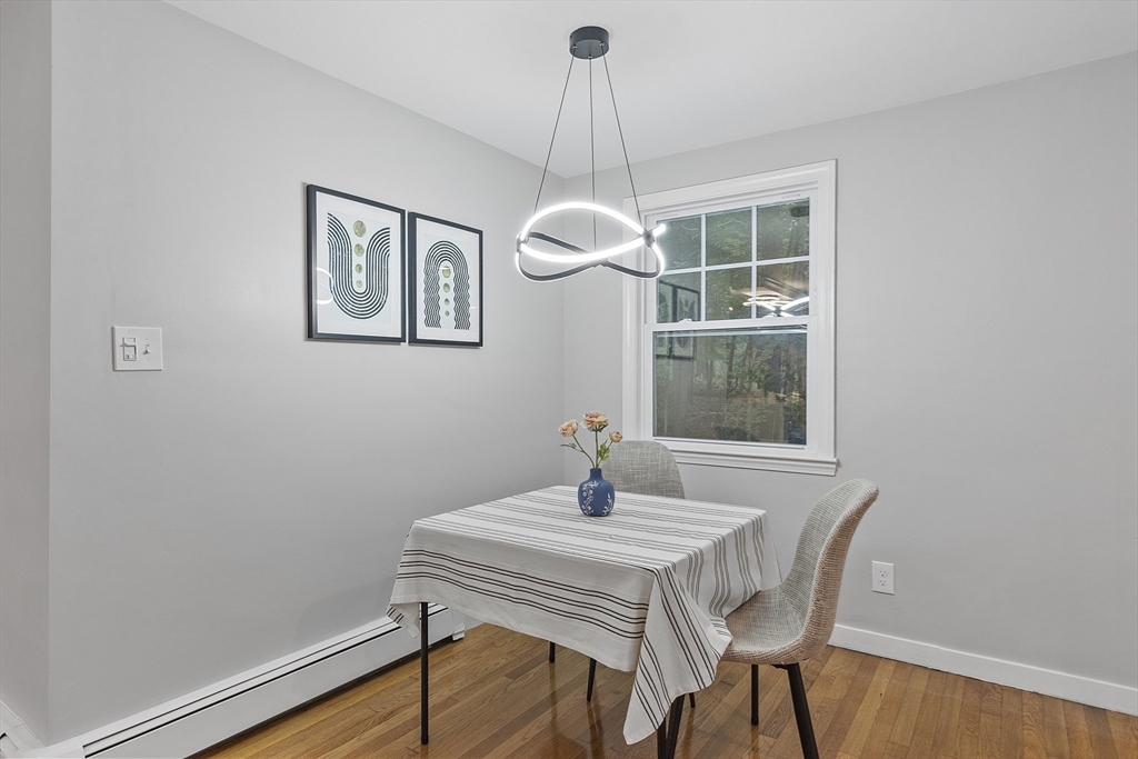 167 Harvard Road Stow, MA 01775 - Photo 6 of 27 a dining room with a table and chairs