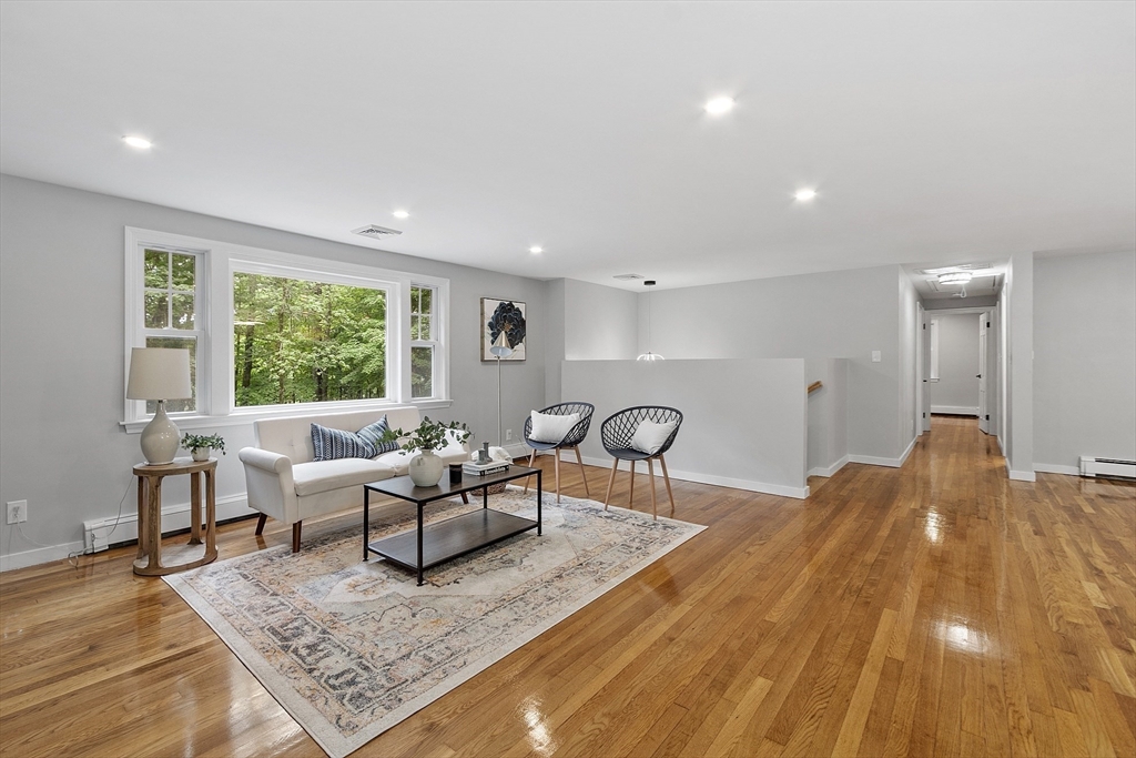 167 Harvard Road Stow, MA 01775 - Photo 8 of 27 a living room with furniture and a table