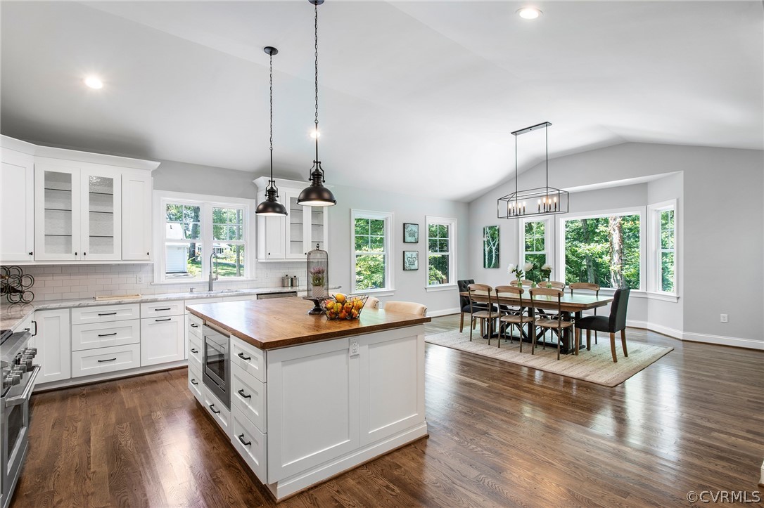 3703 Custis Road Richmond, VA 23225 - Photo 14 of 33 a kitchen with stainless steel appliances granite countertop a stove and a wooden floors