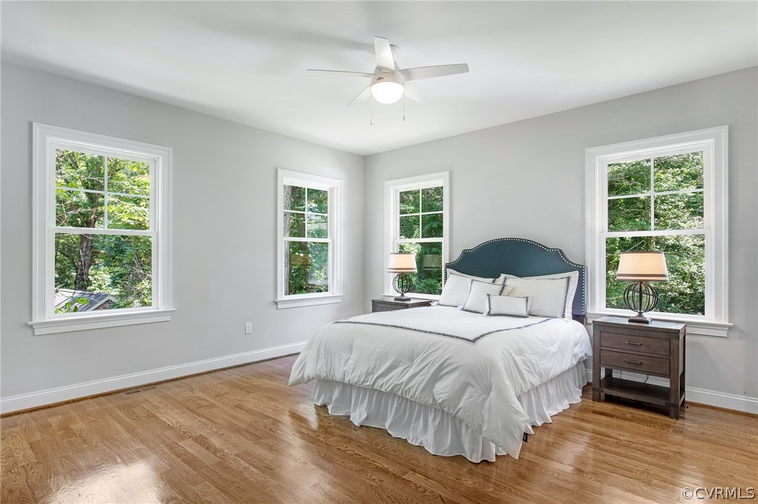 3703 Custis Road Richmond, VA 23225 - Photo 19 of 33 a bedroom with a large bed and a large window