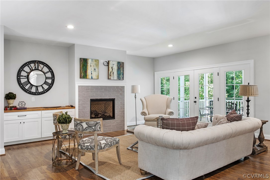 3703 Custis Road Richmond, VA 23225 - Photo 5 of 33 a living room with furniture a large window and a fireplace