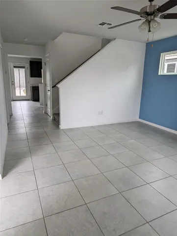 a view of a livingroom with an empty space and a workspace