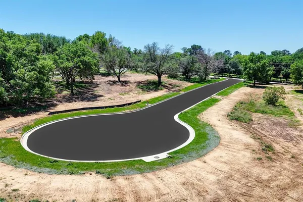 a view of a swimming pool with a yard