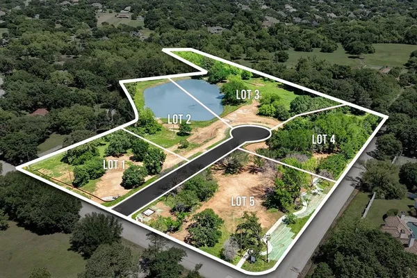 an aerial view of house with a yard