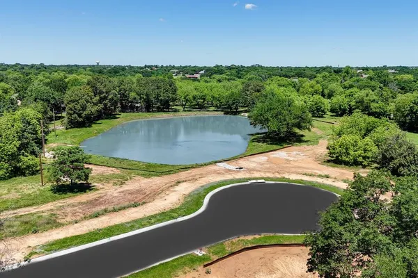 a view of a swimming pool with a yard