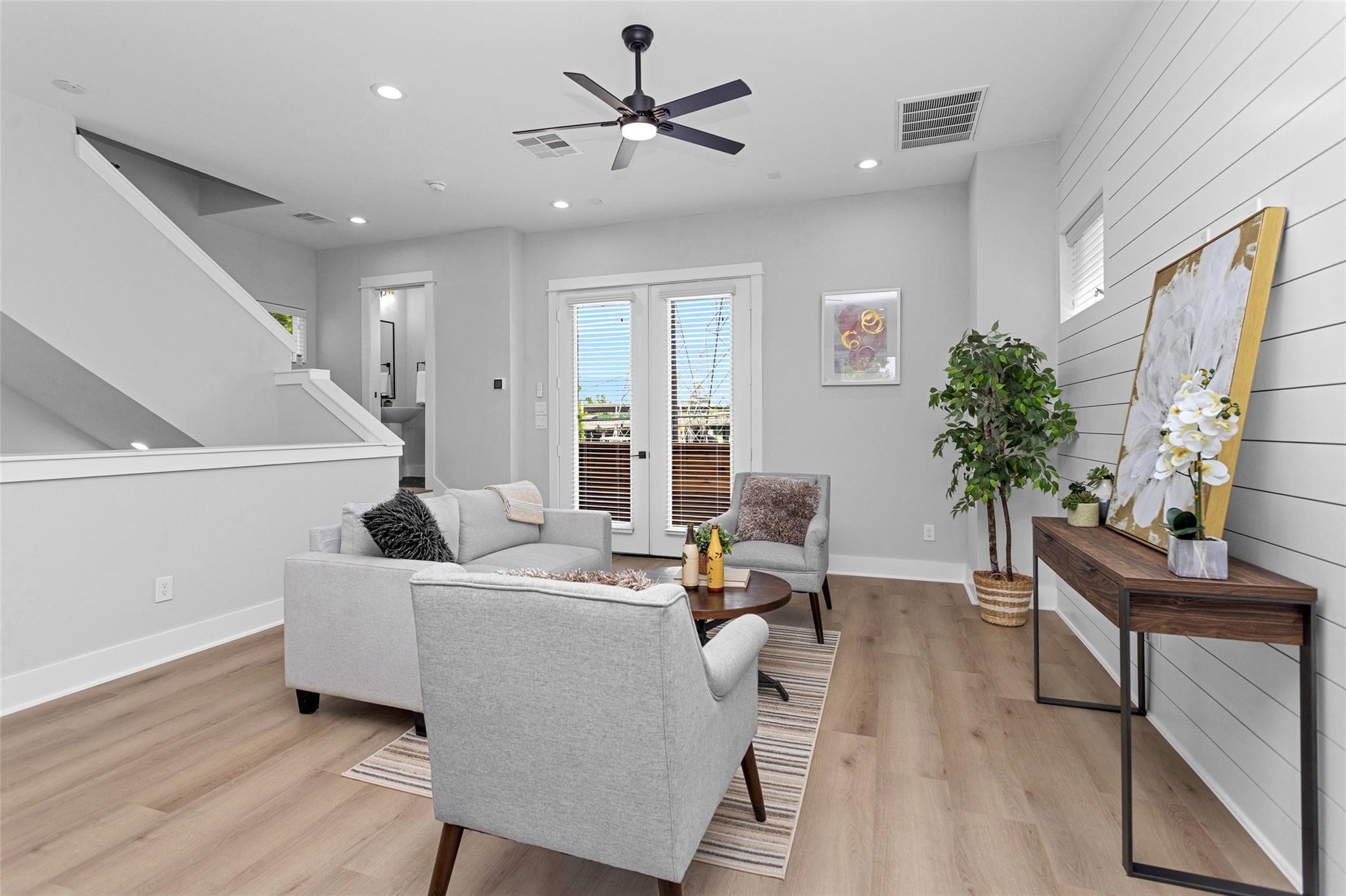 1616 Euel Street Houston, TX 77009 - Photo 18 of 42 a living room with furniture and a potted plant
