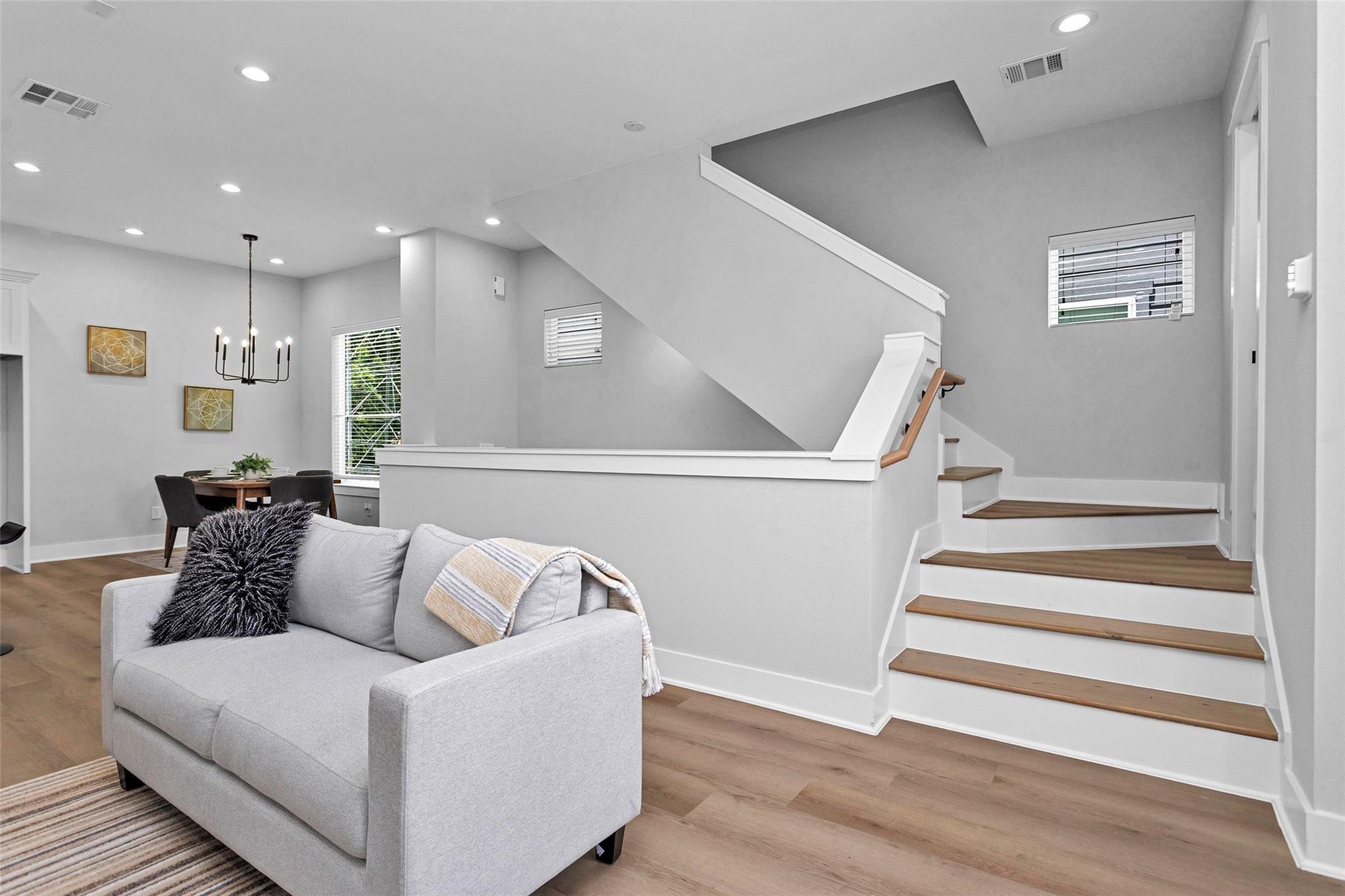 1616 Euel Street Houston, TX 77009 - Photo 21 of 42 a living room with furniture and stairs