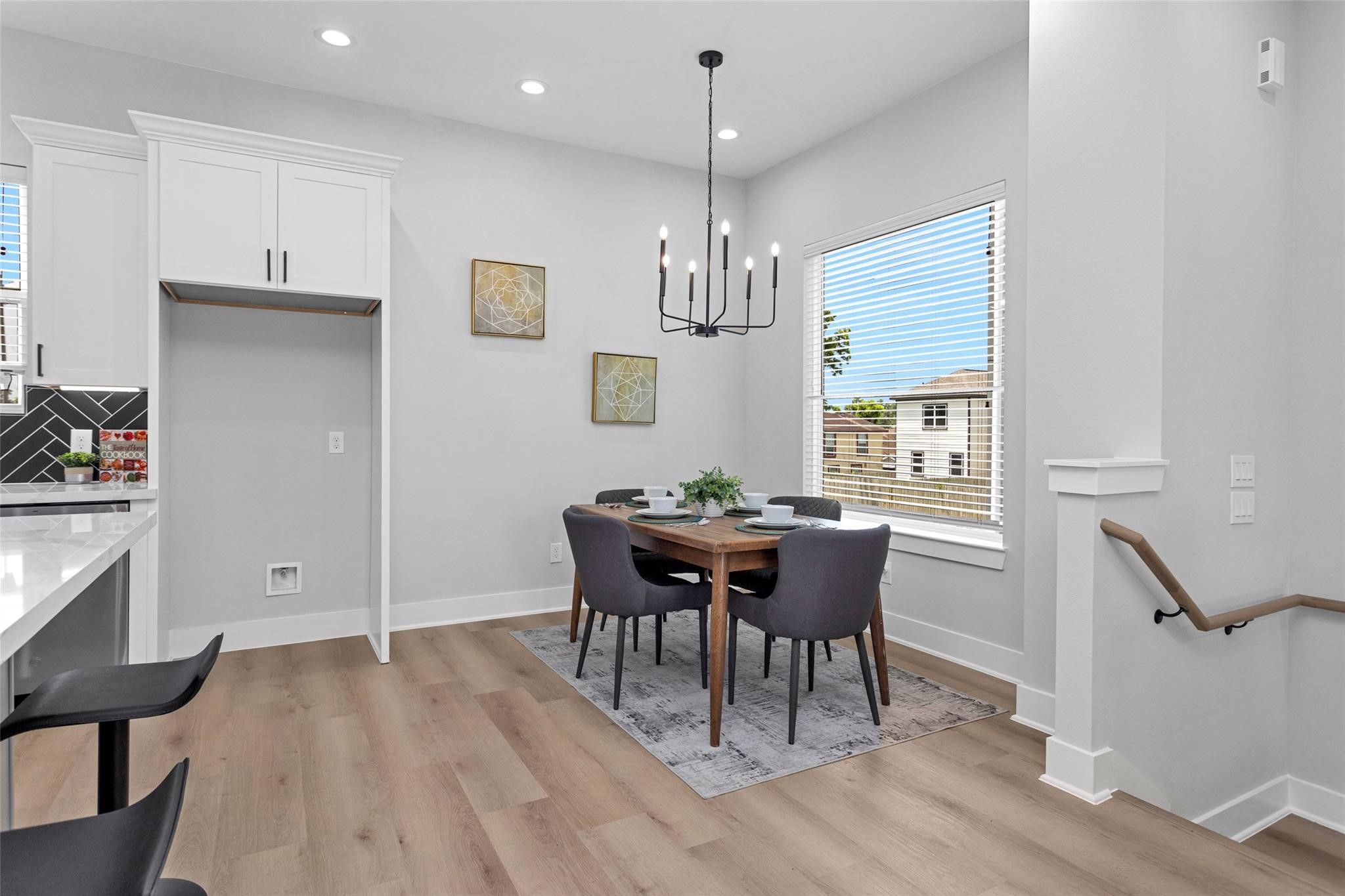 1616 Euel Street Houston, TX 77009 - Photo 22 of 42 a view of a dining room with furniture window and wooden floor