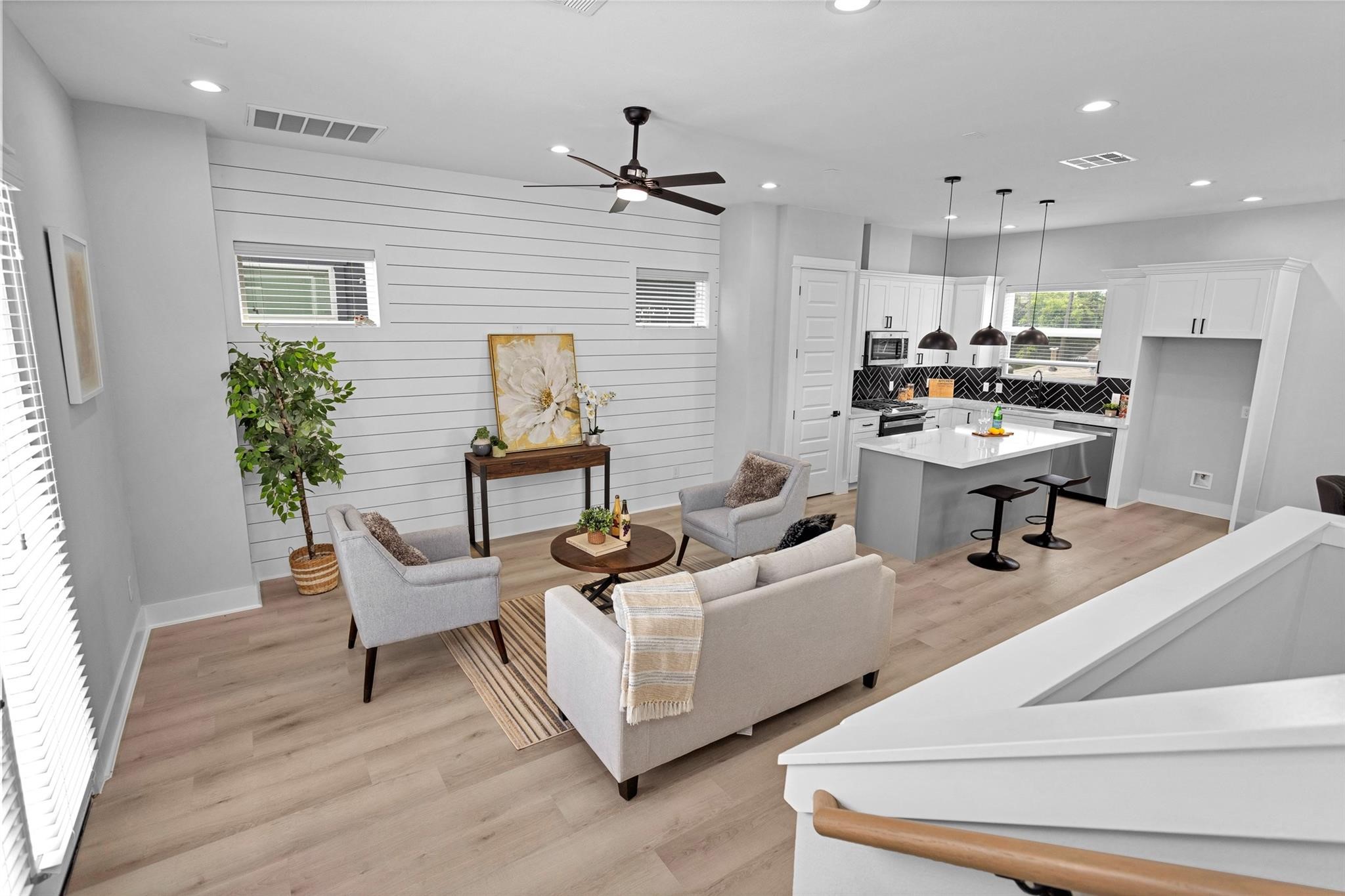 1616 Euel Street Houston, TX 77009 - Photo 27 of 42 a living room with furniture and a potted plant