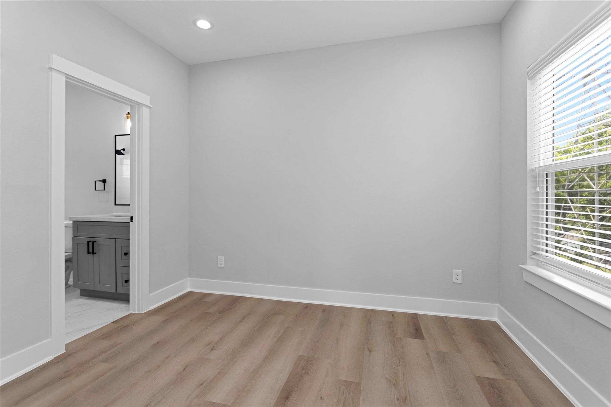 1616 Euel Street Houston, TX 77009 - Photo 28 of 42 an empty room with windows and entrance