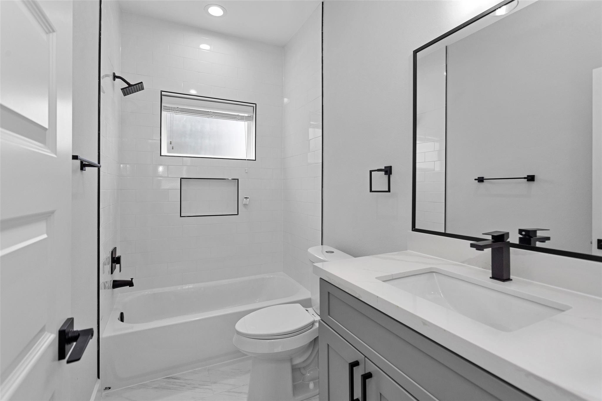 1616 Euel Street Houston, TX 77009 - Photo 31 of 42 a bathroom with a sink a toilet and shower