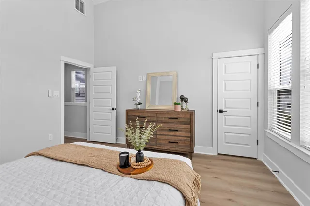a bathroom with a granite countertop sink mirror bathtub and double