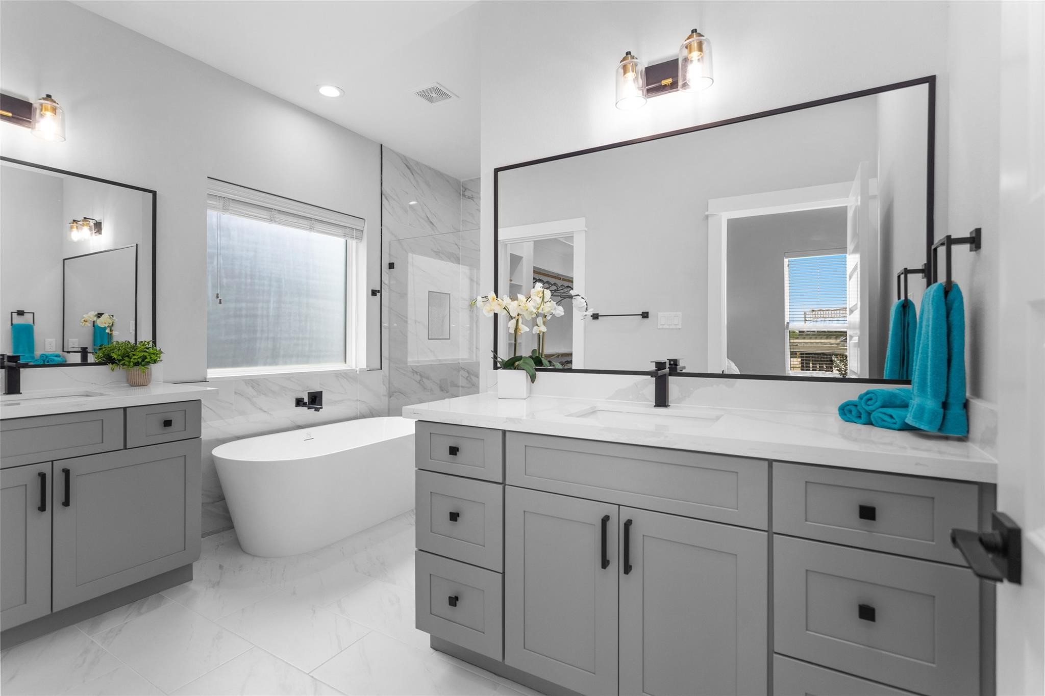 1616 Euel Street Houston, TX 77009 - Photo 35 of 42 a bathroom with a granite countertop sink mirror bathtub and double
