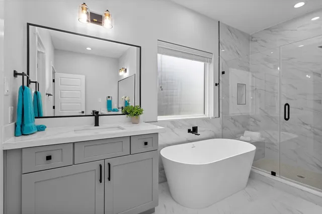 a bathroom with a bathtub and a shower