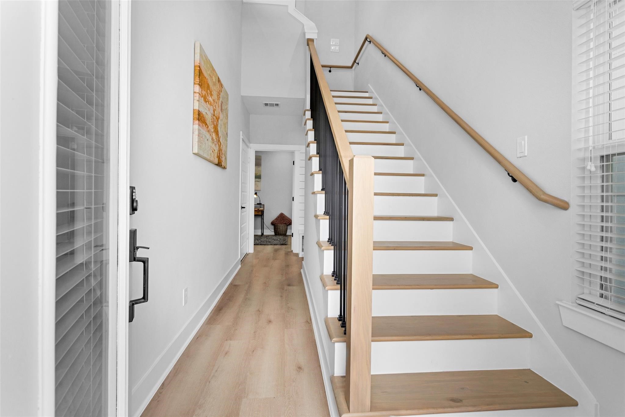 1616 Euel Street Houston, TX 77009 - Photo 4 of 42 a view of a hallway with wooden floor and entryway