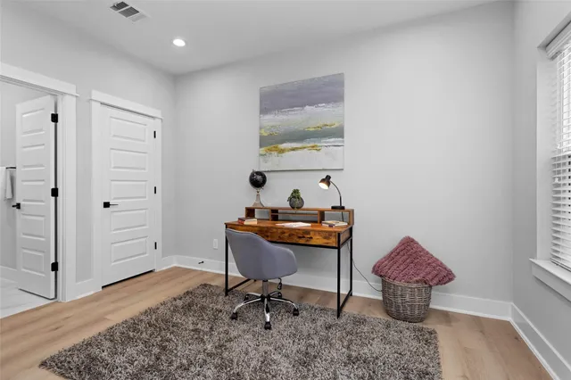 a workspace with furniture and window