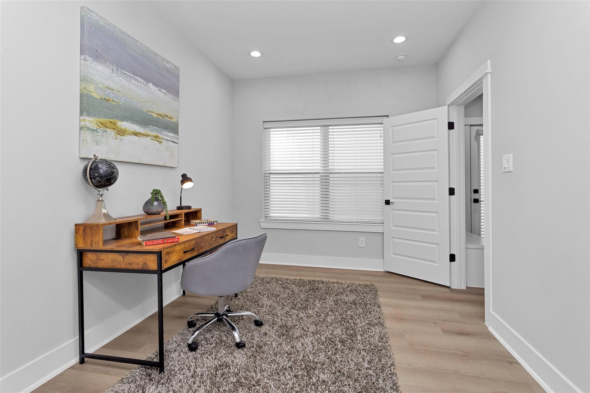 1616 Euel Street Houston, TX 77009 - Photo 9 of 42 a view of a workspace with furniture