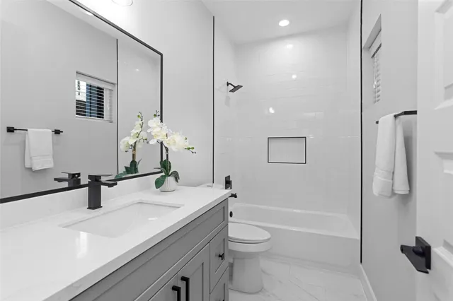 a kitchen with a sink stainless steel appliances and cabinets