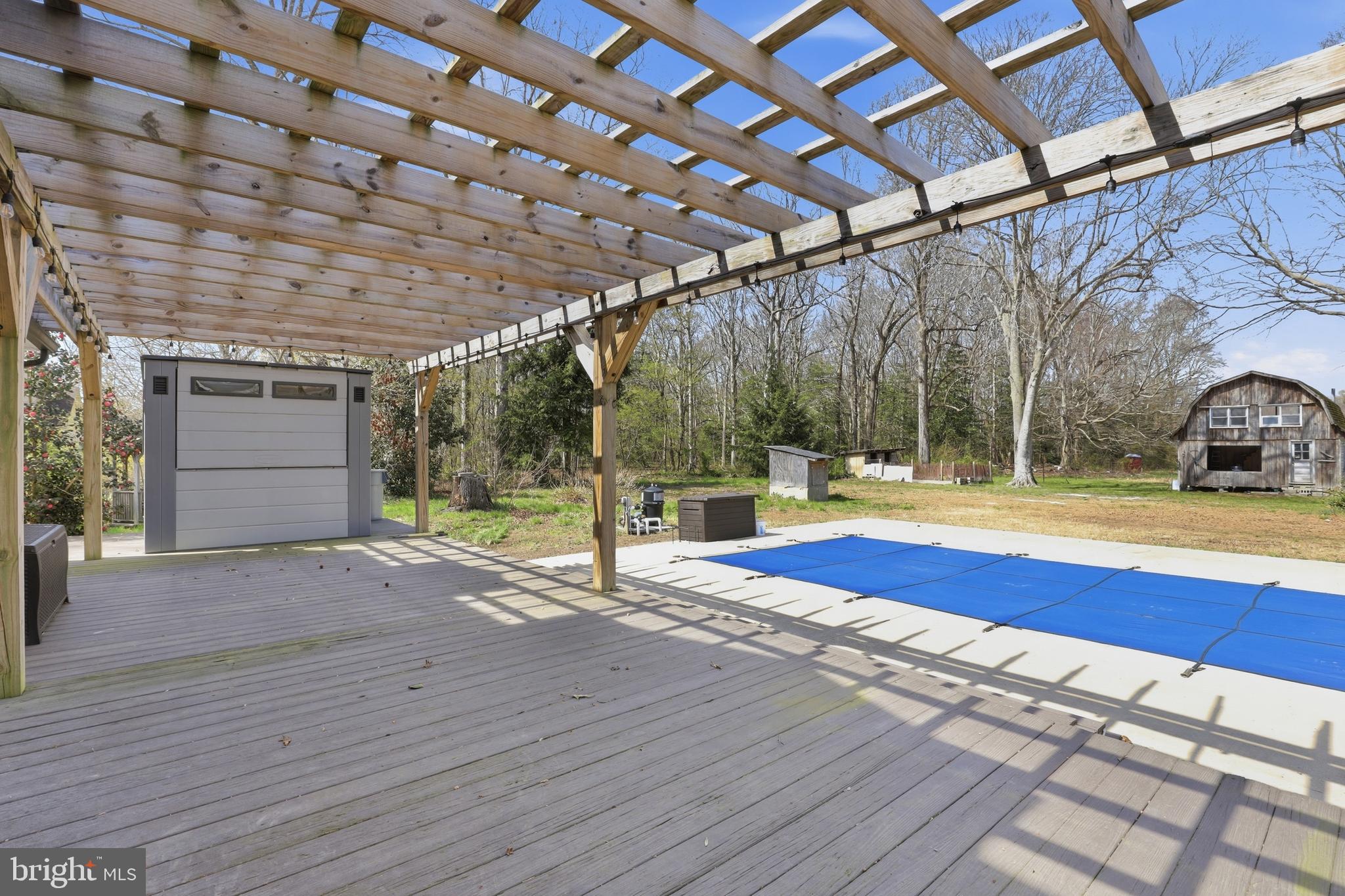 11326 Shawnee Road Greenwood, DE 19950 - Photo 34 of 57 a view of swimming pool with sitting area
