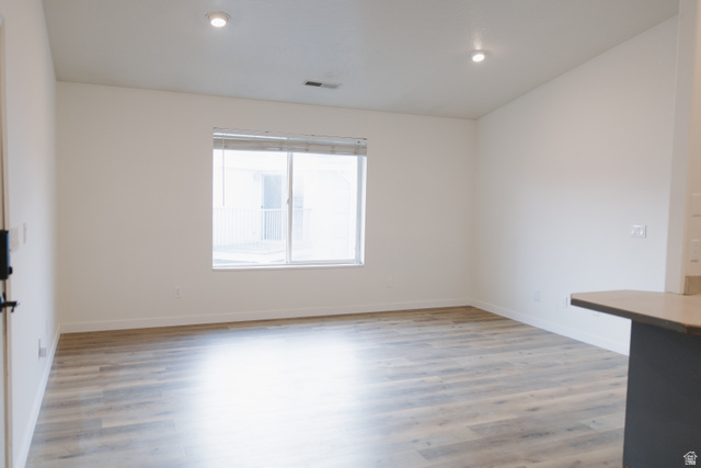 215 South 1050th West, Unit 10 Provo, UT 84601 - Photo 4 of 38 Empty room featuring light wood-type flooring and recessed lighting