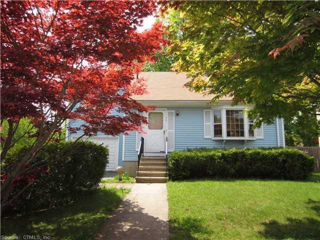 33 Williamsburg Road Bridgeport, CT 06606 - Photo 1 of 1 a backyard of a house with plants and large tree