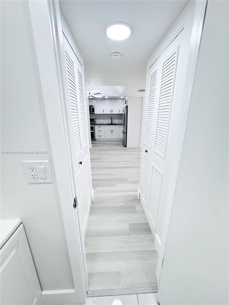 3660 Inverrary Drive, Unit 1Y Lauderhill, FL 33319 - Photo 10 of 24 a view of staircase with white walls and windows