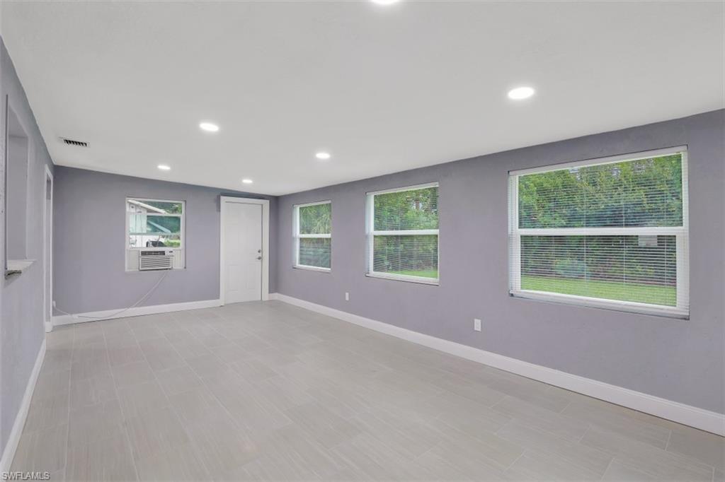 19109 Birch Road Fort Myers, FL 33967 - Photo 13 of 24 an empty room with windows