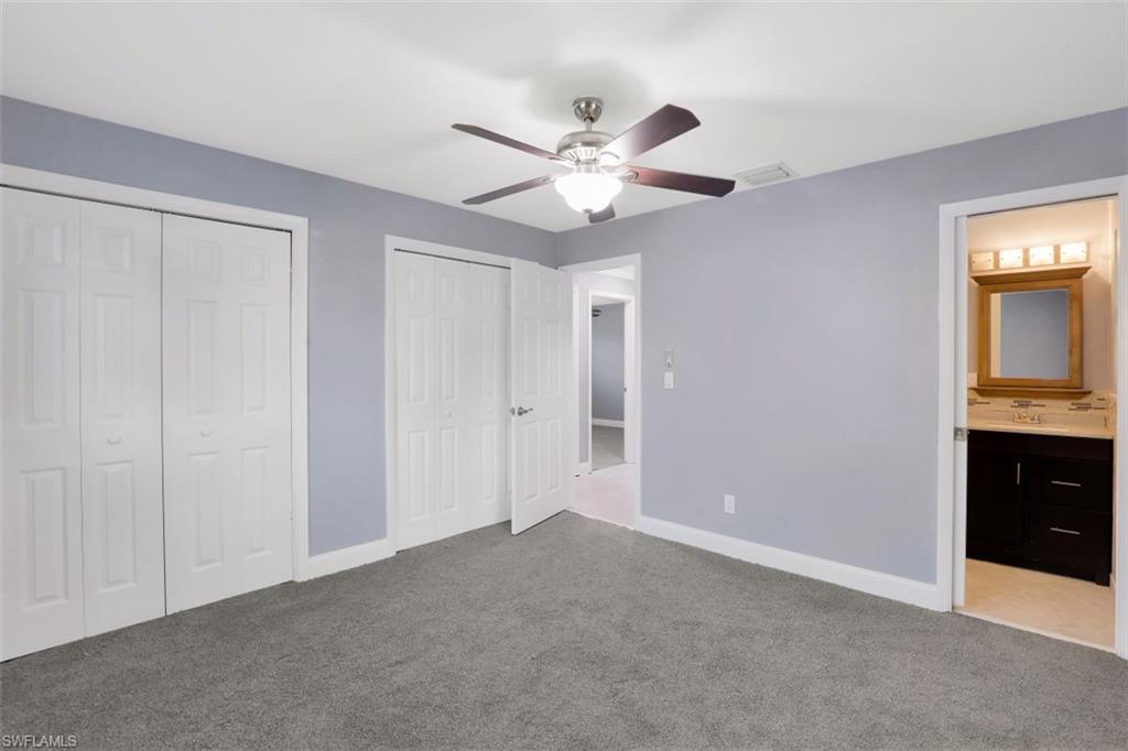 19109 Birch Road Fort Myers, FL 33967 - Photo 15 of 24 a view of an empty room with a chandelier fan