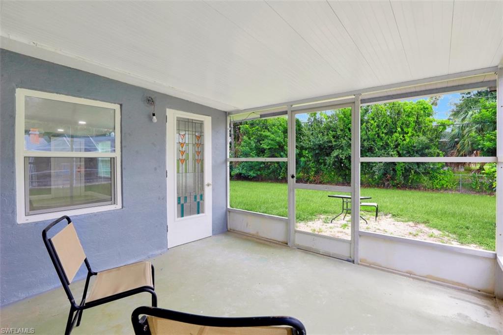 19109 Birch Road Fort Myers, FL 33967 - Photo 22 of 24 a view of an empty room with yard and balcony