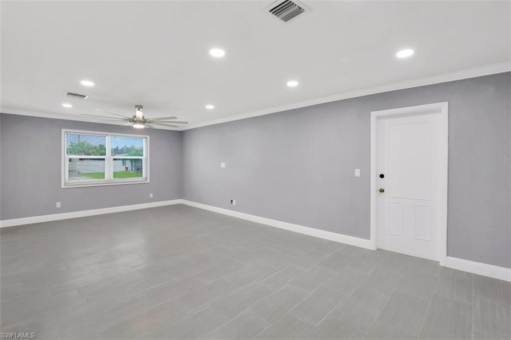 19109 Birch Road Fort Myers, FL 33967 - Photo 5 of 24 an empty room with windows