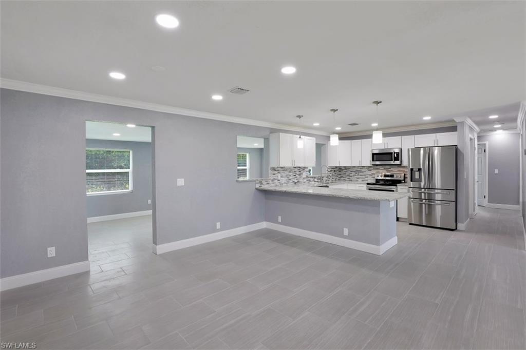 19109 Birch Road Fort Myers, FL 33967 - Photo 9 of 24 a view of kitchen with refrigerator sink and stove