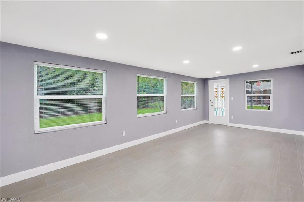 19109 Birch Road Fort Myers, FL 33967 - Photo 10 of 24 a view of an empty room with a window