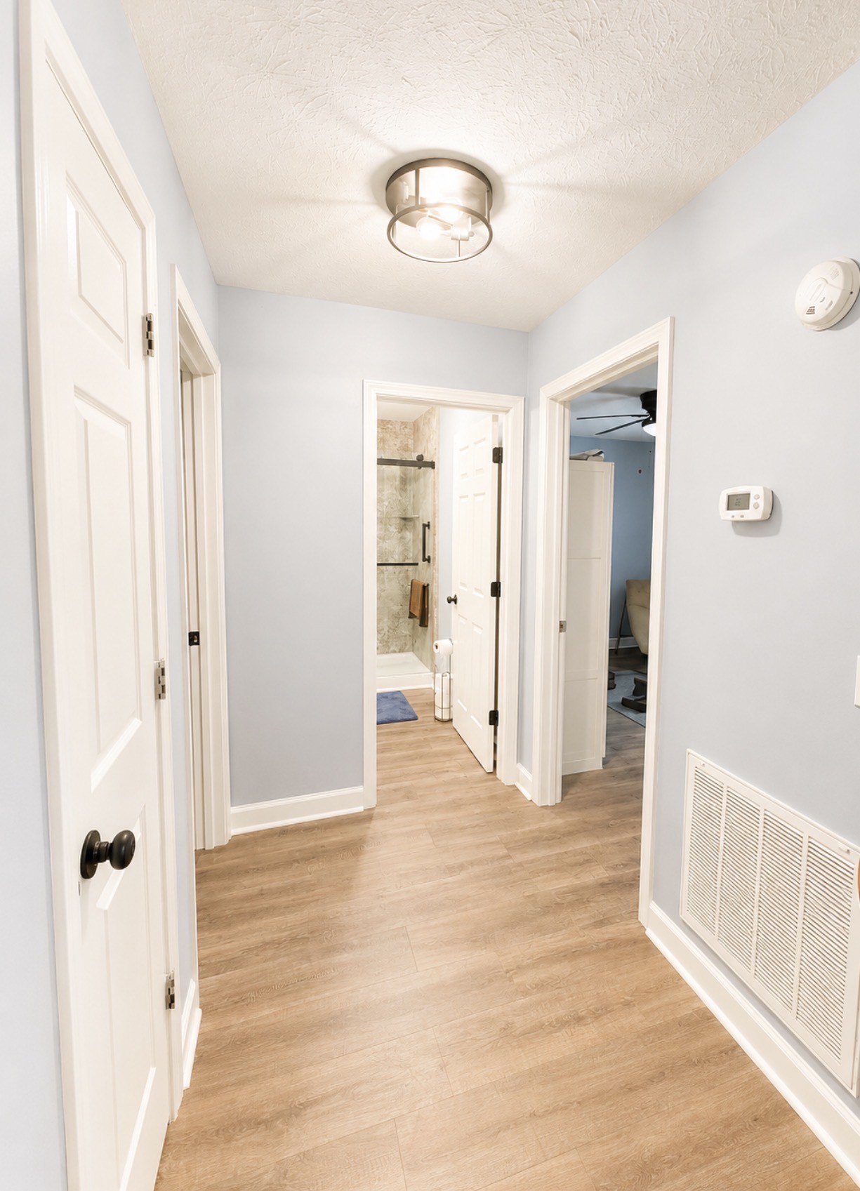 153 Henry Harris Road Westmoreland, TN 37186 - Photo 12 of 18 a view of a hallway with wooden floor and closet area