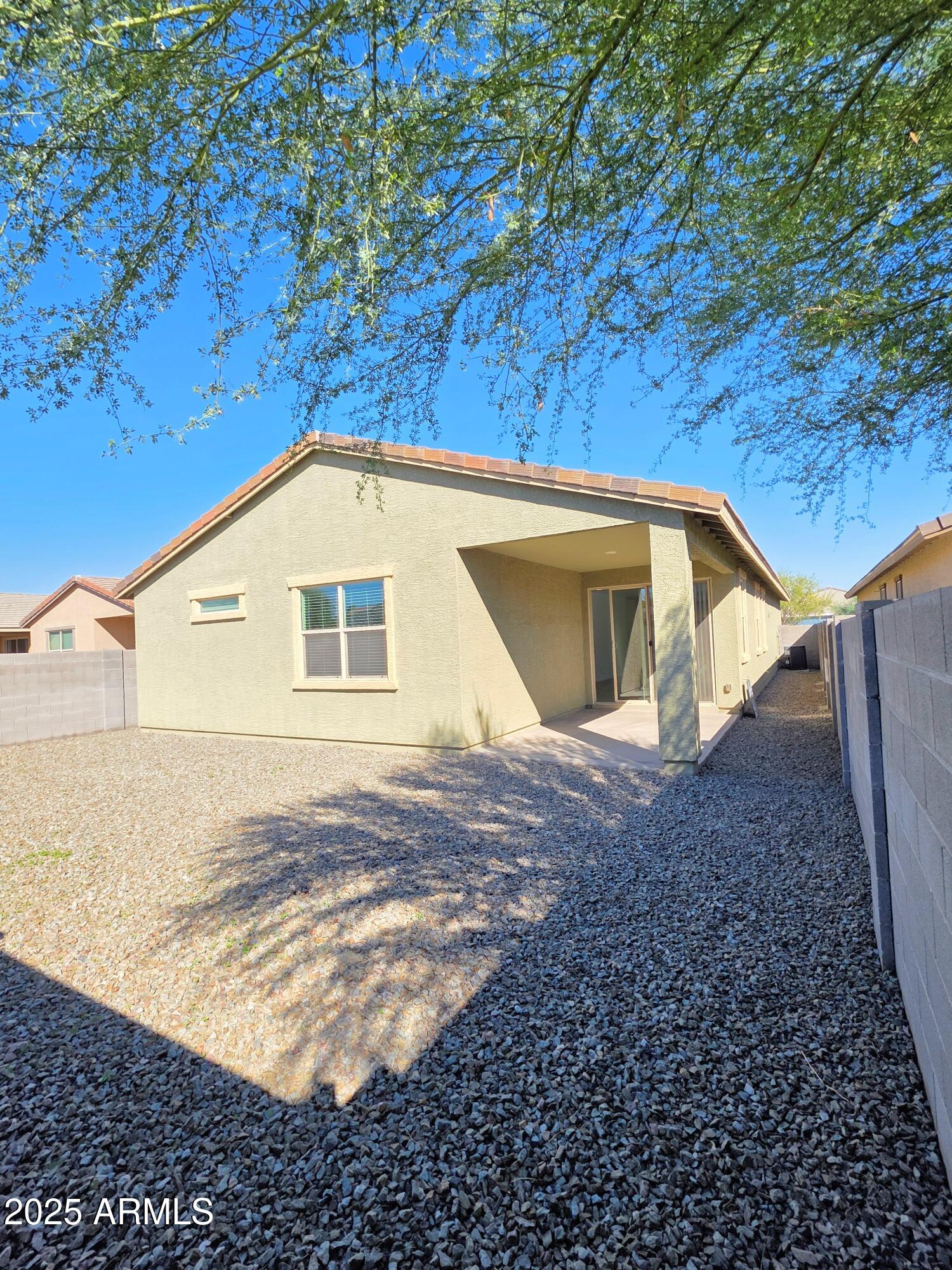 4214 North 68th Lane Phoenix, AZ 85043 - Photo 12 of 13 a view of a house with a yard