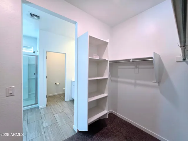 a view of an empty walk in closet