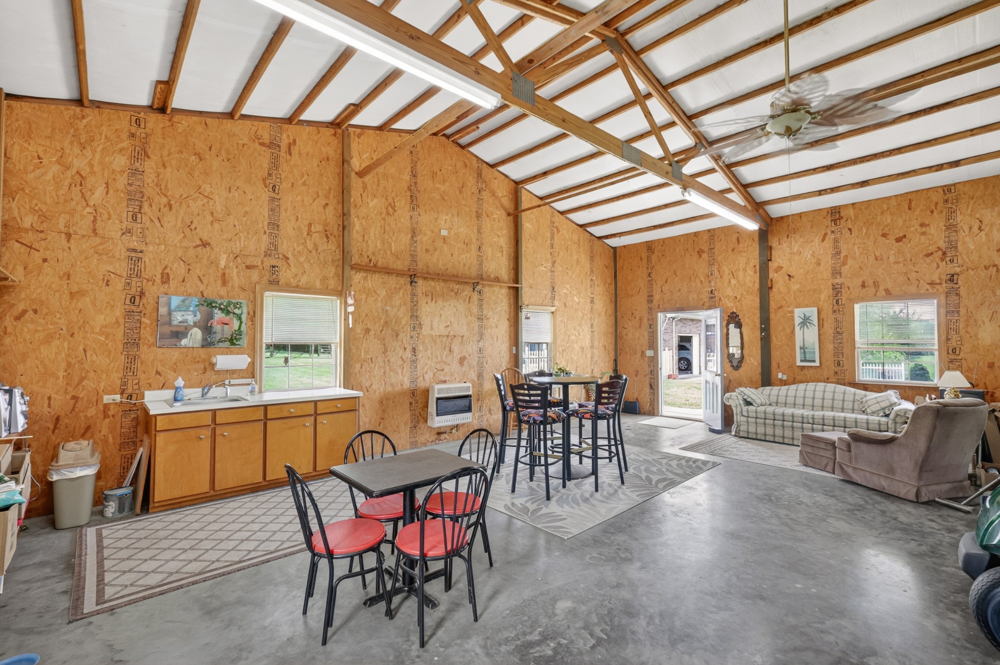 590 Allisona Road Eagleville, TN 37060 - Photo 28 of 55 a dining room with furniture a chandelier and wooden floor