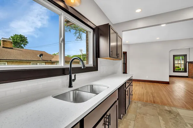 a kitchen with sink and window