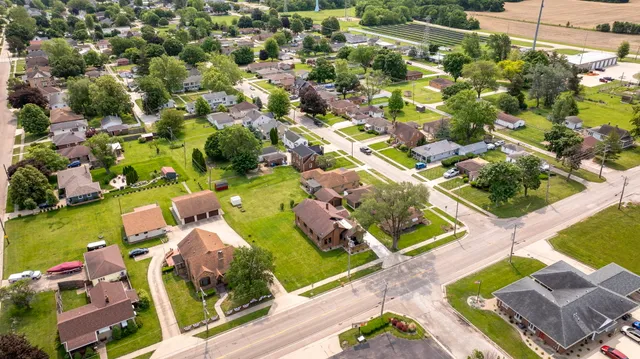 an aerial view of residential houses with outdoor space