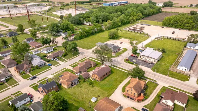 an aerial view of residential houses with outdoor space
