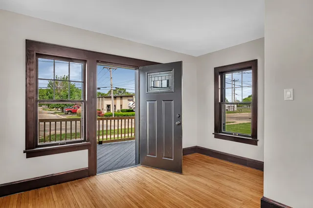 a view of an empty room with glass door