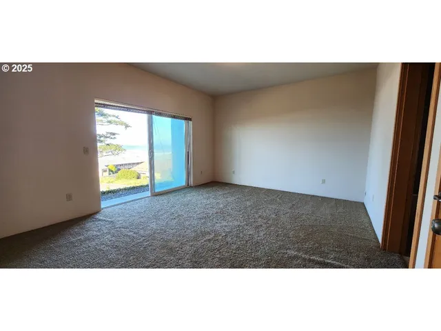 view of an empty room with a window