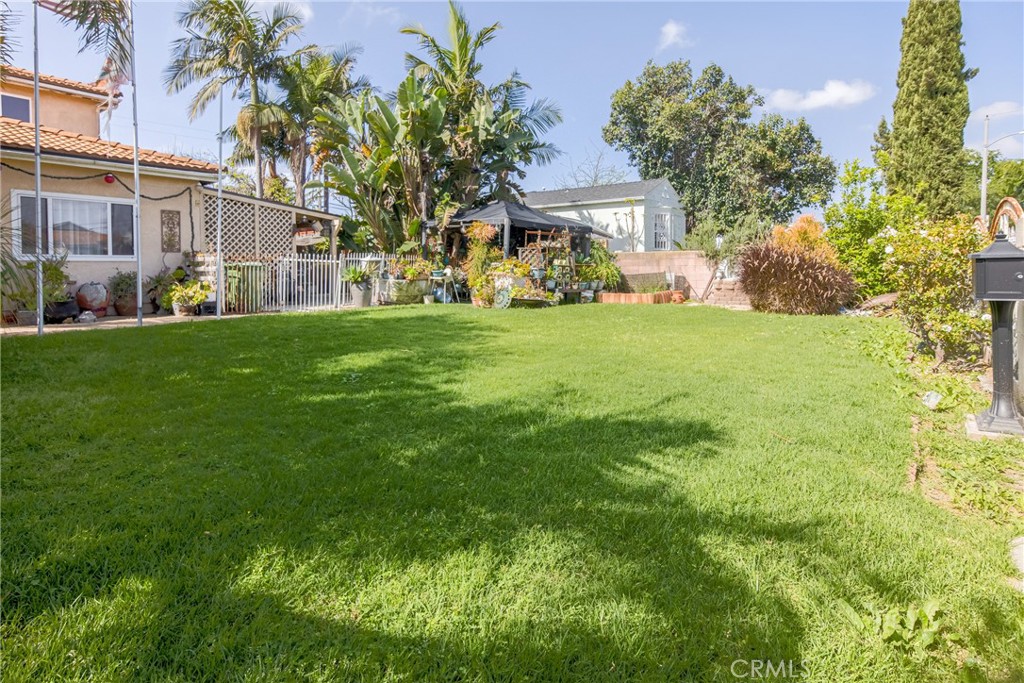 1302 West 132nd Street Compton, CA 90222 - Photo 2 of 10 a view of a front of a house with a yard