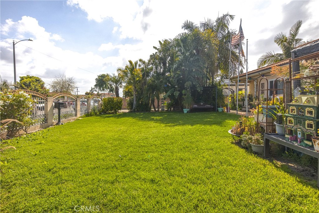 1302 West 132nd Street Compton, CA 90222 - Photo 4 of 10 a view of a house with a yard table and chairs