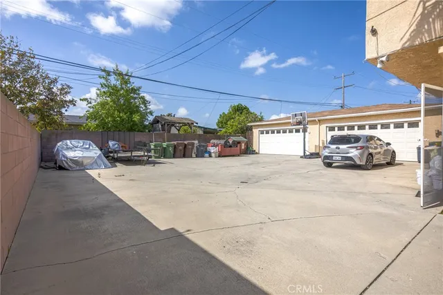 a view of a backyard with plants and a garden