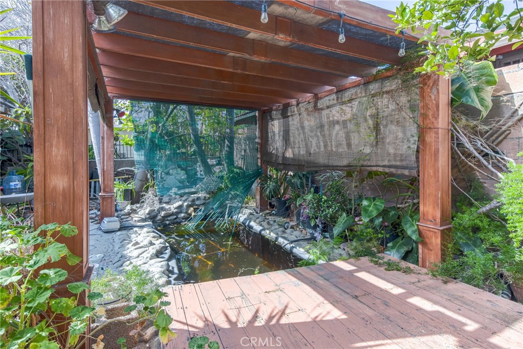 1302 West 132nd Street Compton, CA 90222 - Photo 9 of 10 a view of a backyard with plants and a garden
