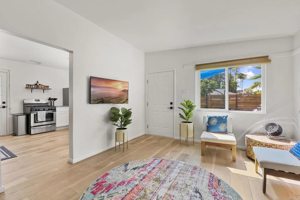 1153 Aloha Drive Encinitas, CA 92024 - Photo 11 of 50 a living room with furniture and a potted plant