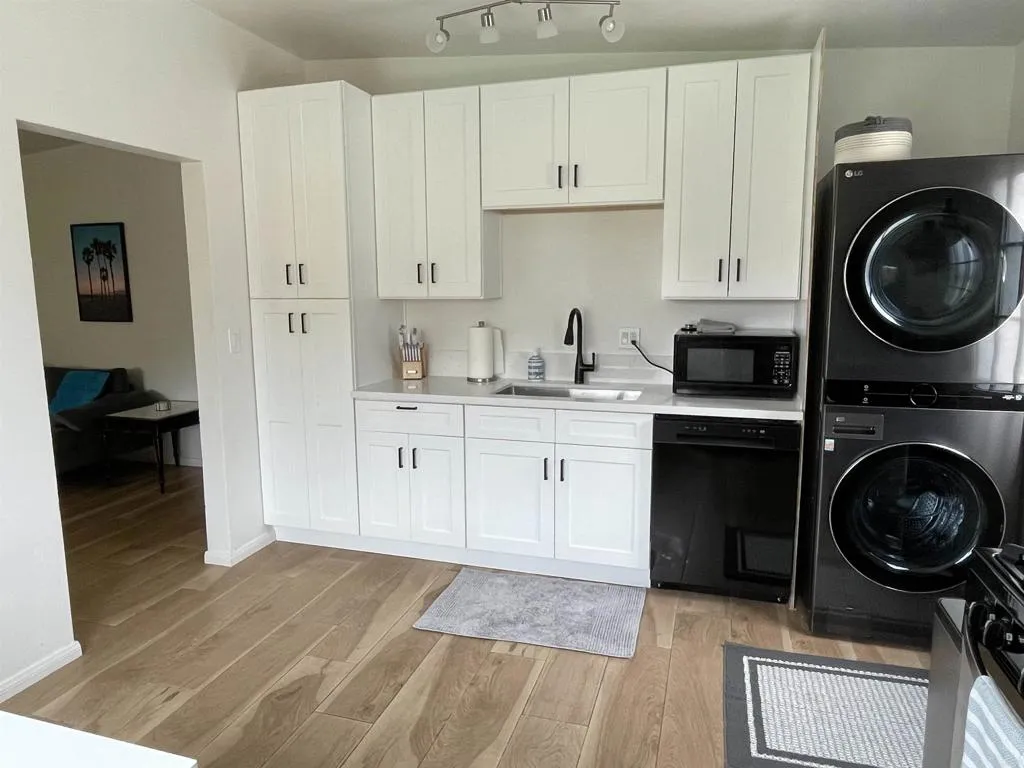1153 Aloha Drive Encinitas, CA 92024 - Photo 13 of 50 a utility room with sink dryer and washer